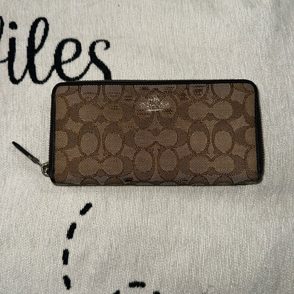 Coach canvas signature tan and brown zip around long wallet card slot on back